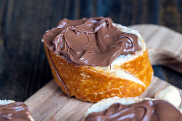 chocolate butter spread on a baguette, close up