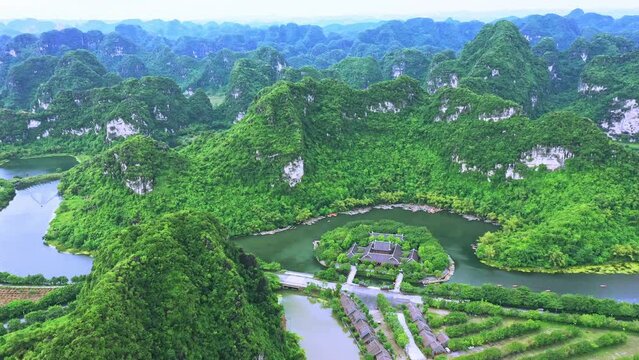 Aerial view, Drone view,Drone footage of Sao Khe river and the Trang An Scenic Landscape Complex in Trang An, Ninh Binh Province, Vietnam.