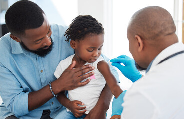 Healthcare, vaccine and doctor with child patient cleaning shoulder with hygiene material with help...