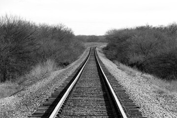 Fototapeta premium spooky black and white photograph retro vintage rural train tracks transportation railway countryside transport rails deserted track