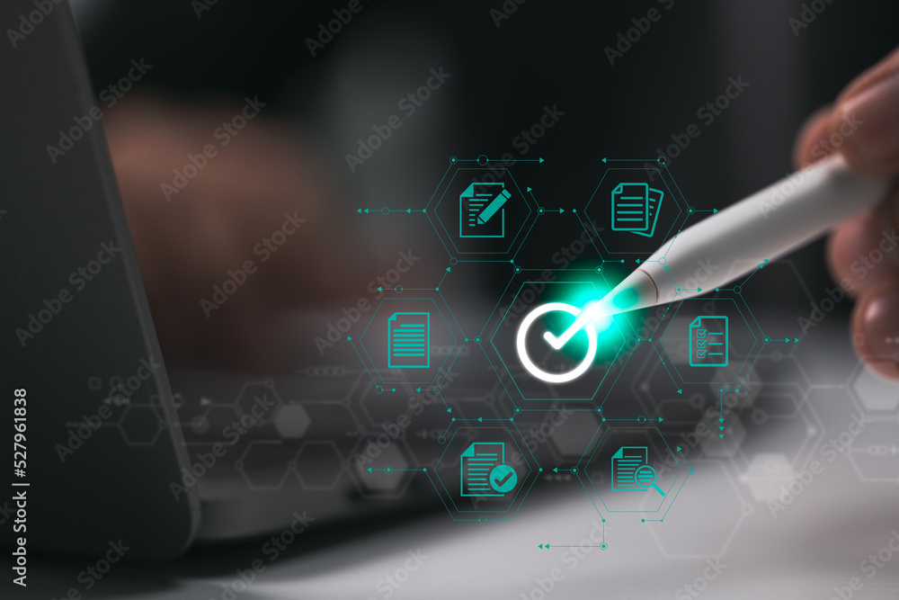 Poster businessman signing e-document with stylus pen on digital tablet to assure quality.