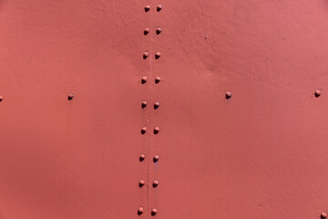 Part of the metal structure of an old steam locomotive