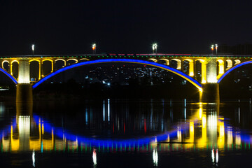 brige over river at night