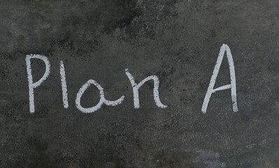 Plan A Phrase Written on Blackboard with White Chalk in Horizontal Orientation