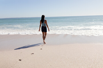 Caucasian woman standing on the beach