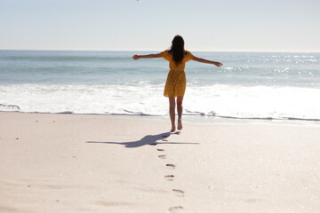 Caucasian woman standing on the beach