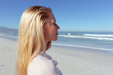 Fototapeta na wymiar Caucasian woman enjoying at beach