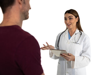 Smiling Caucasian female doctor wearing lab coat and stethoscope using digital tablet with male pati