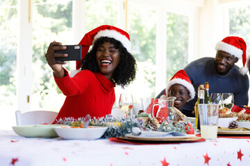Multi generation african american family taking a selfie with smartphone