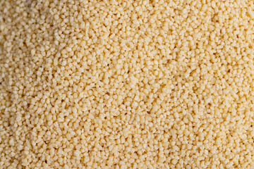 Fresh raw porridge couscous from wheat or millet