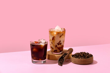 Ice coffee in a tall glass with cream poured over and coffee beans. Set with different types of...