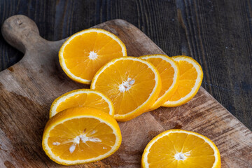ripe orange cut into slices during cooking
