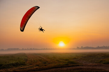 paraglider over the sunset