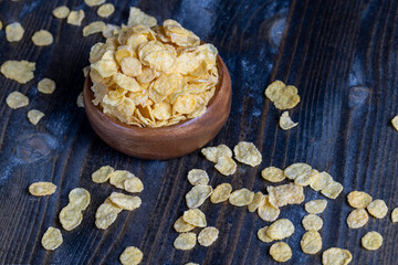 dry breakfast corn flakes of yellow color , close up