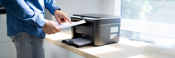 Midsection Side View Of Businessman Pressing Printer's Button