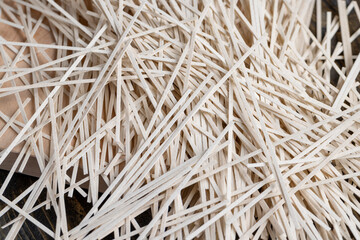 Rice pasta on a table and a wooden board