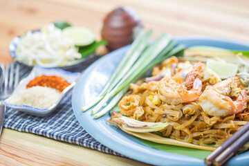 Pad Thai - Rice noodles with shrimps and vegetables close-up on the table.