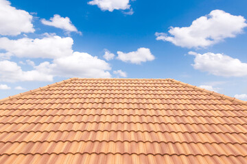 Roof tiles and sky sunlight. Roofing Contractors concept Installing House roof.