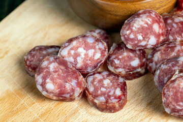 Cut the finished sausage into pieces on a cutting board