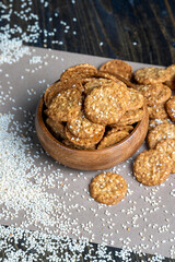 oatmeal thin round cookies with lots of sesame seeds