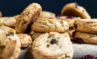 delicious dried cookies made of high-quality flour with dried red cranberries on the table