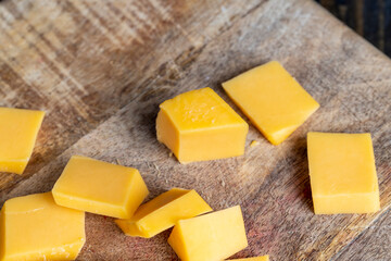 Sliced yellow cheese made from cow's milk