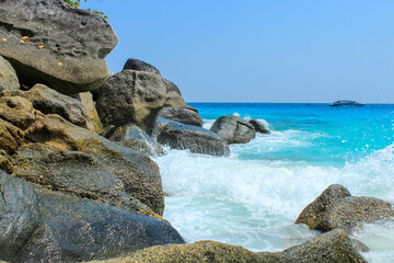 Close up on granite rocks of Koh Similan, turquoise water, blue sky with copy space for text, wallpaper, background, Phuket, Thailand
