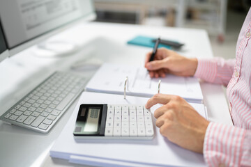 Fototapeta na wymiar Public Tax Accountant Using Calculator