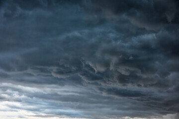 Naklejka na ściany i meble Powerful storm clouds in the evening.