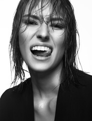 Happy smiling woman with Wet Hair. Beautiful laughing Lady. White teeth smile