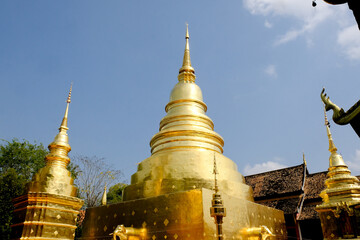 Naklejka premium The gold pagoda in Wat Phra Sing Waramahavihan temple. Phrae province, Thailand.