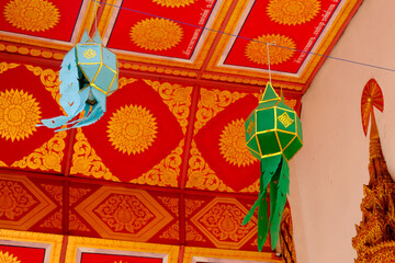 Colorful Lanna hanging lamp in temple at Thailand,isolated art wall.