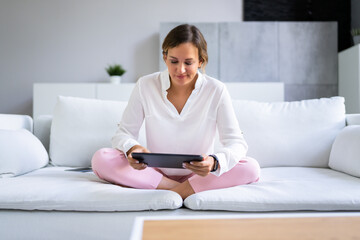 Smiling Woman Using Digital Tablet © Andrey Popov