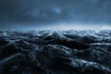 Gordijnen Surface level shot of waves in sea  © vectorfusionart