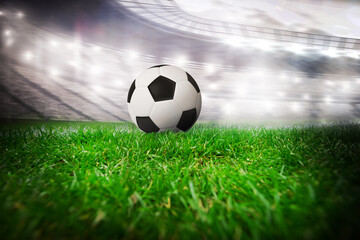 Naklejka premium Soccer ball in soccer stadium
