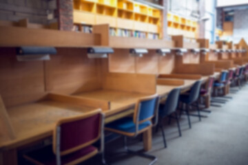 Empty chairs arranged in library