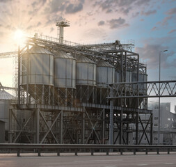 Fototapeta na wymiar Elevator tanks for grain storage, drying and processing. Agricultural grain factory.