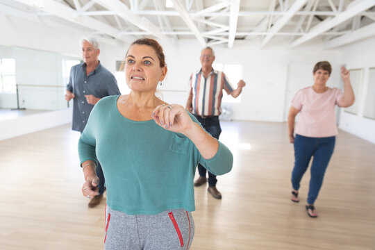Caucasian senior couples ballroom dancing