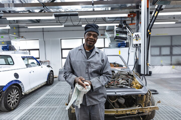 Portrait of a happy African American mechanic man