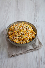 Homemade Slow Cooker Creamed Corn in a Bowl, side view.
