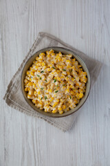Homemade Slow Cooker Creamed Corn in a Bowl, top view. Flat lay, overhead, from above.