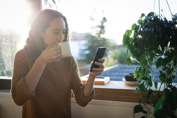 Woman having coffee. Social distancing in quarantine lockdown during coronavirus epidemic.