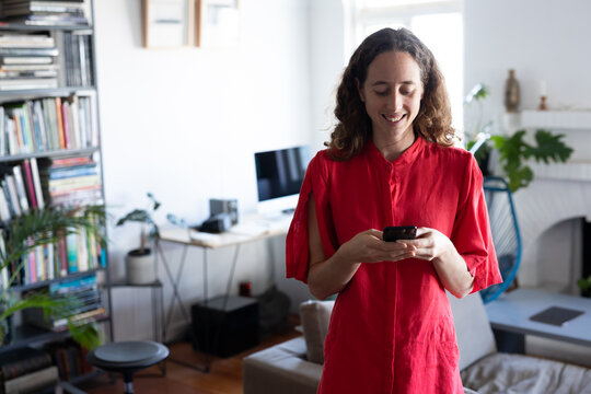 Caucasian Woman Using Her Phone Self Isolating At Home During Coronavirus Covid19 Pandemic 