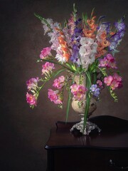 Still life with bouquet of gladiolus flowers