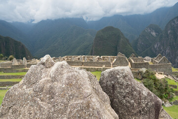 Machu picchu, pre columbian inca site situated on a mountain ridge above the urubamba valley in Peru.