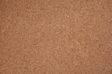 Cork board background is used for design work.