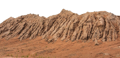 Mountain view isolates of large sand mounds eroded by rain are seen in the rainy season road...
