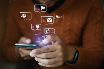 yonug man using mobile phone play social.