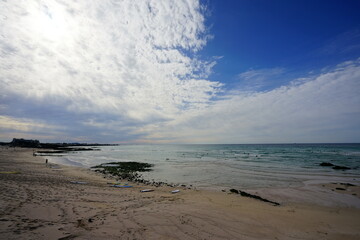 autumn sea and clouds and people