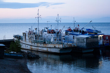 ships on Lake Baikal at dawn summer near the village of Bolshye Koty Bolshaya Baikal Trail © Lena